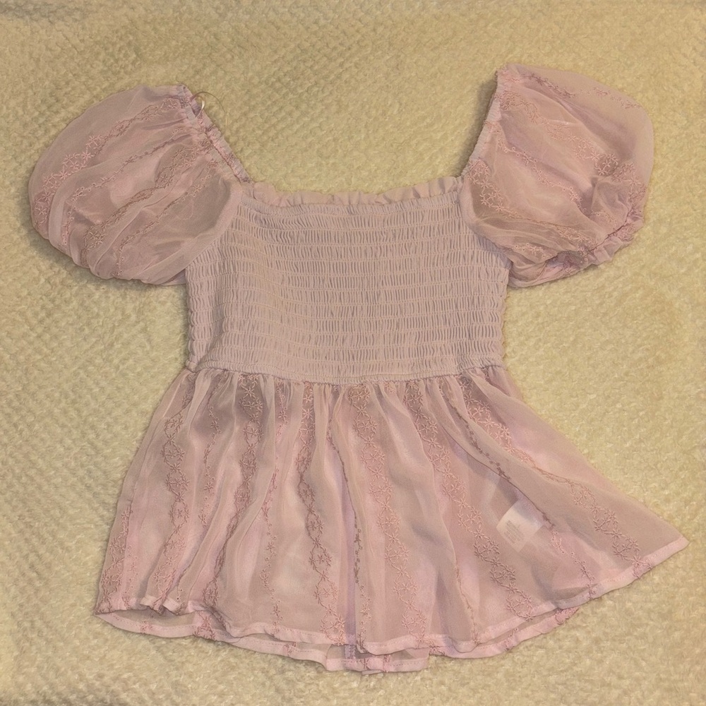 Francesca’s light pink sheer top